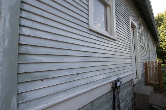 Exterior of house very fading with white paint in OMaha, NE.