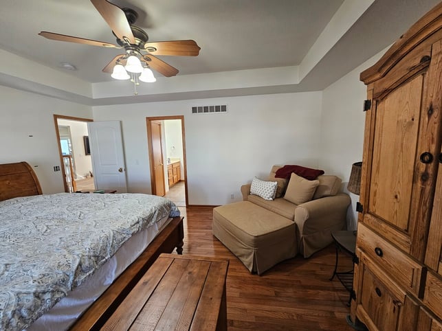 Bedroom with walls and ceiling painted white.