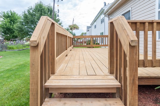 Wood deck that is ready for new stain outside of a home in Omaha.