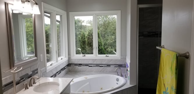 Bathroom with window trim painted white in Omaha, NE.