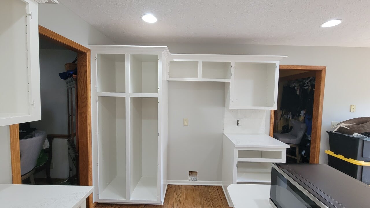 Kitchen Cabinet boxes or frames after being sprayed with white paint by Brush & Roll Painting in Omaha, NE.