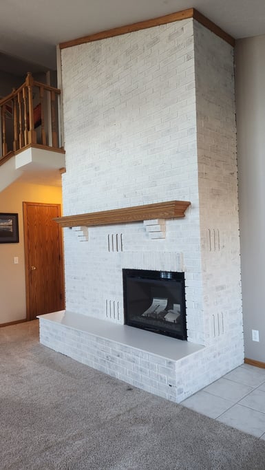 Close up of fireplace limewashed white in Omaha, nE.