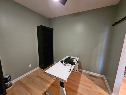 Office painted sage green with white trim inside a home in Omaha, NE.