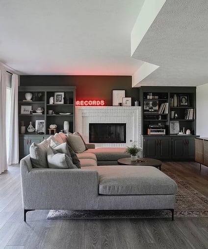 Living room with fireplace brick painted white.