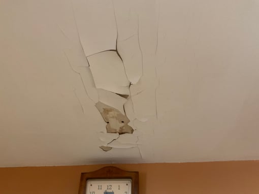Large ceiling cracked inside a living room in a Omaha home.