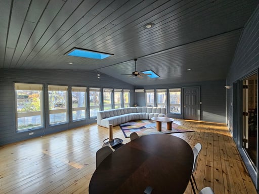 Sunroom painted with walls, trim, and ceiling one dark navy color in Omaha, NE.