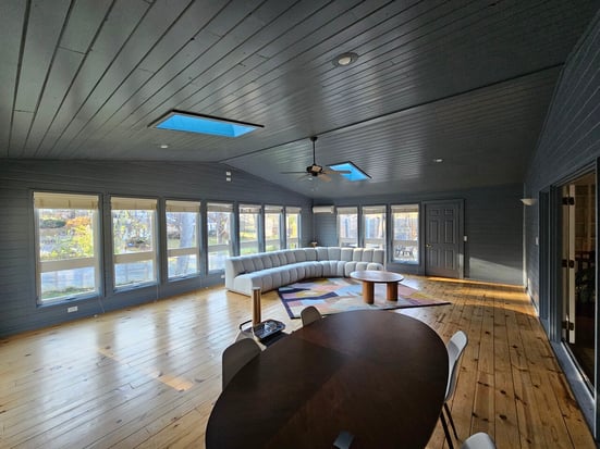Sunroom painted a dark deep blue color on walls trim and ceiling in Papillion.