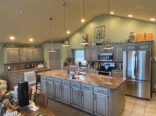 Gray walls with light green cabinets