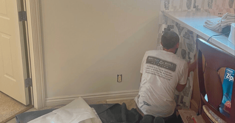 Brush & Roll Painting crew lead removing wallpaper.