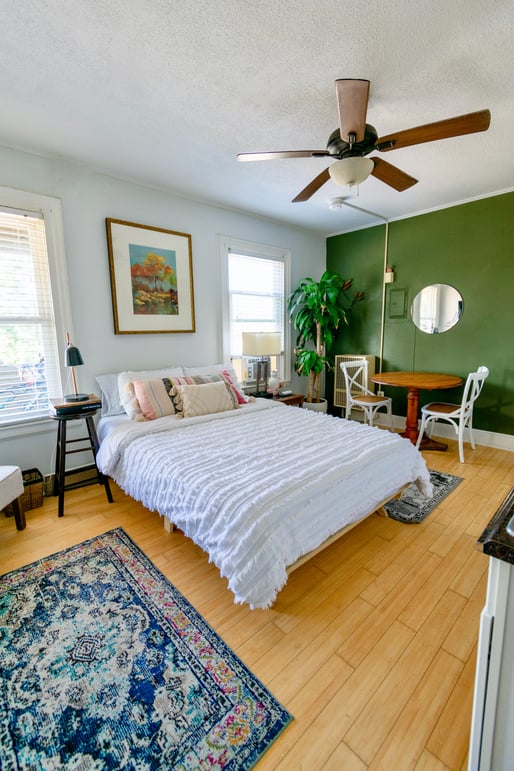 Bedroom with green accent wall
