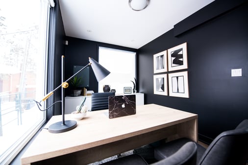 Home office with black walls