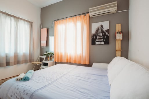 Airbnb bedroom with gray painted walls