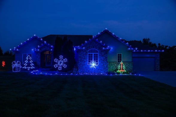 Blue colored Christmas Lights on the outside of a home in Omaha, NE.