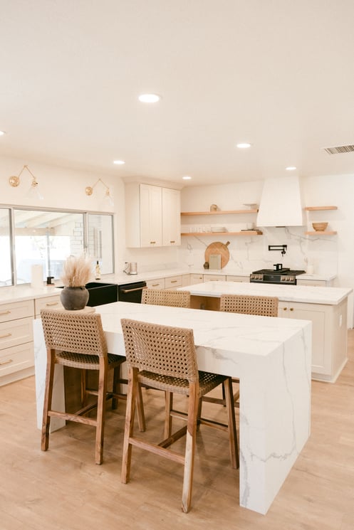 Kitchen with white walls and cabinets