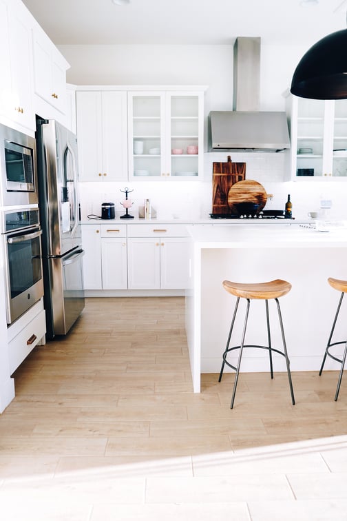 Kitchen with white painted cabinets