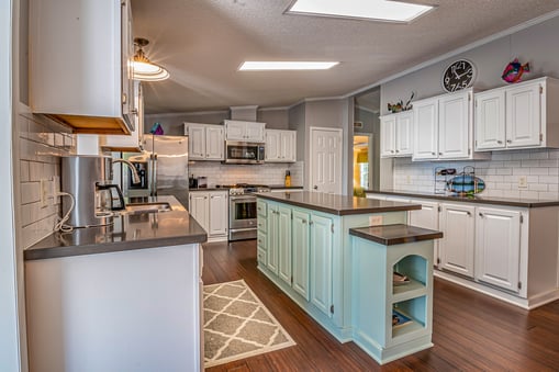 Gray walls with white kitchen cabinets