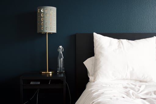 Bedroom with navy blue walls