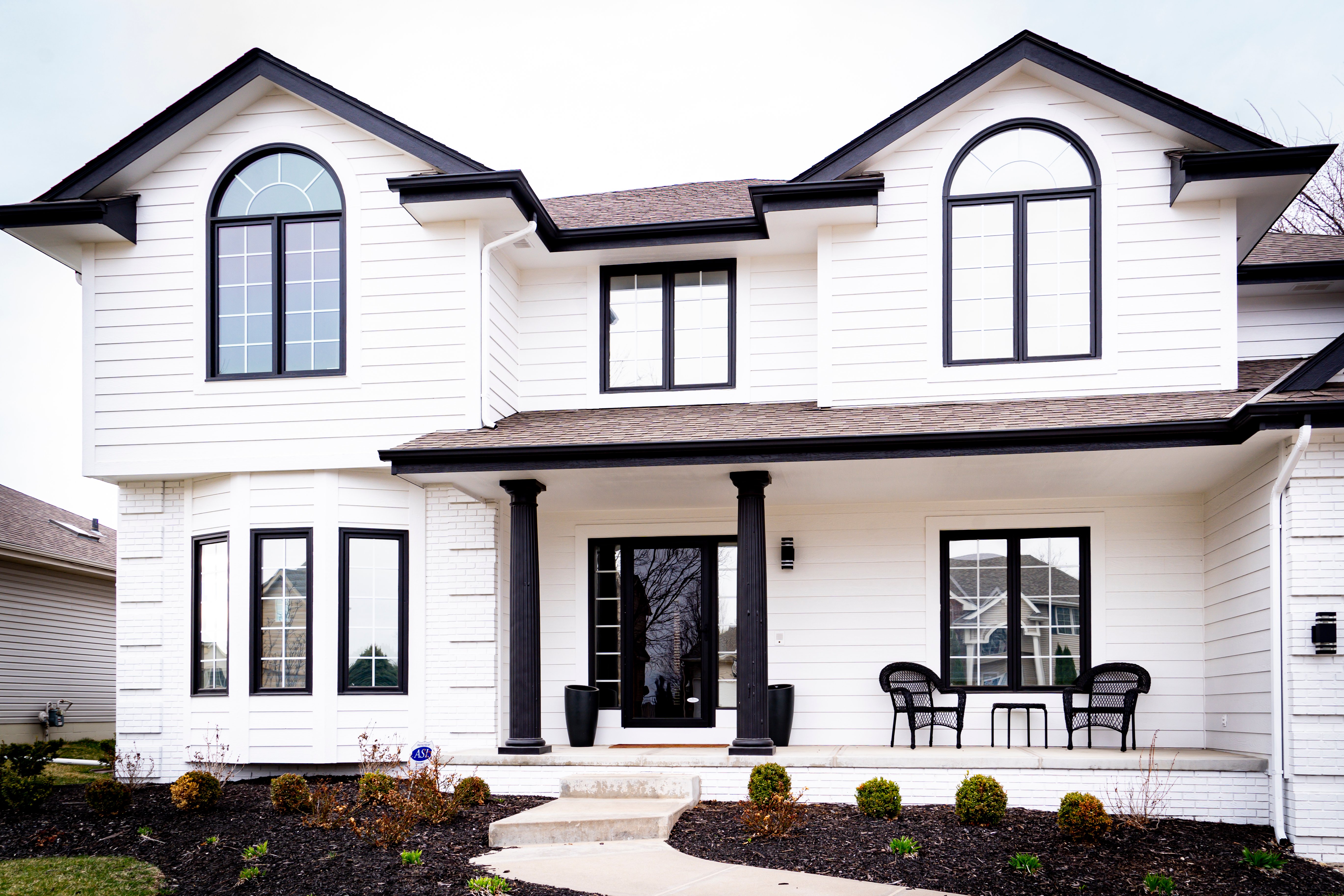 White painted exterior home with black trim.