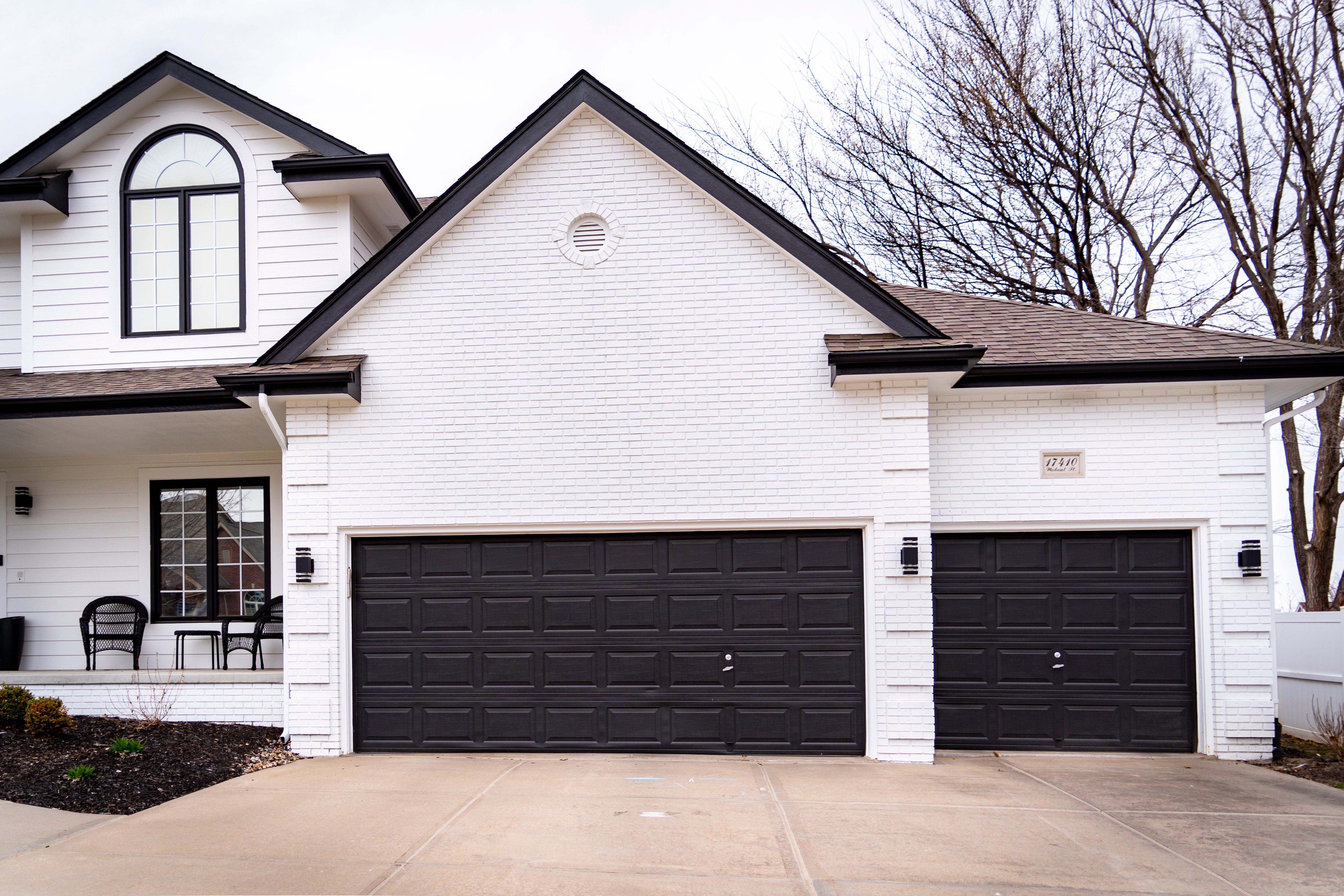 White exterior painted home with black trim and accents.