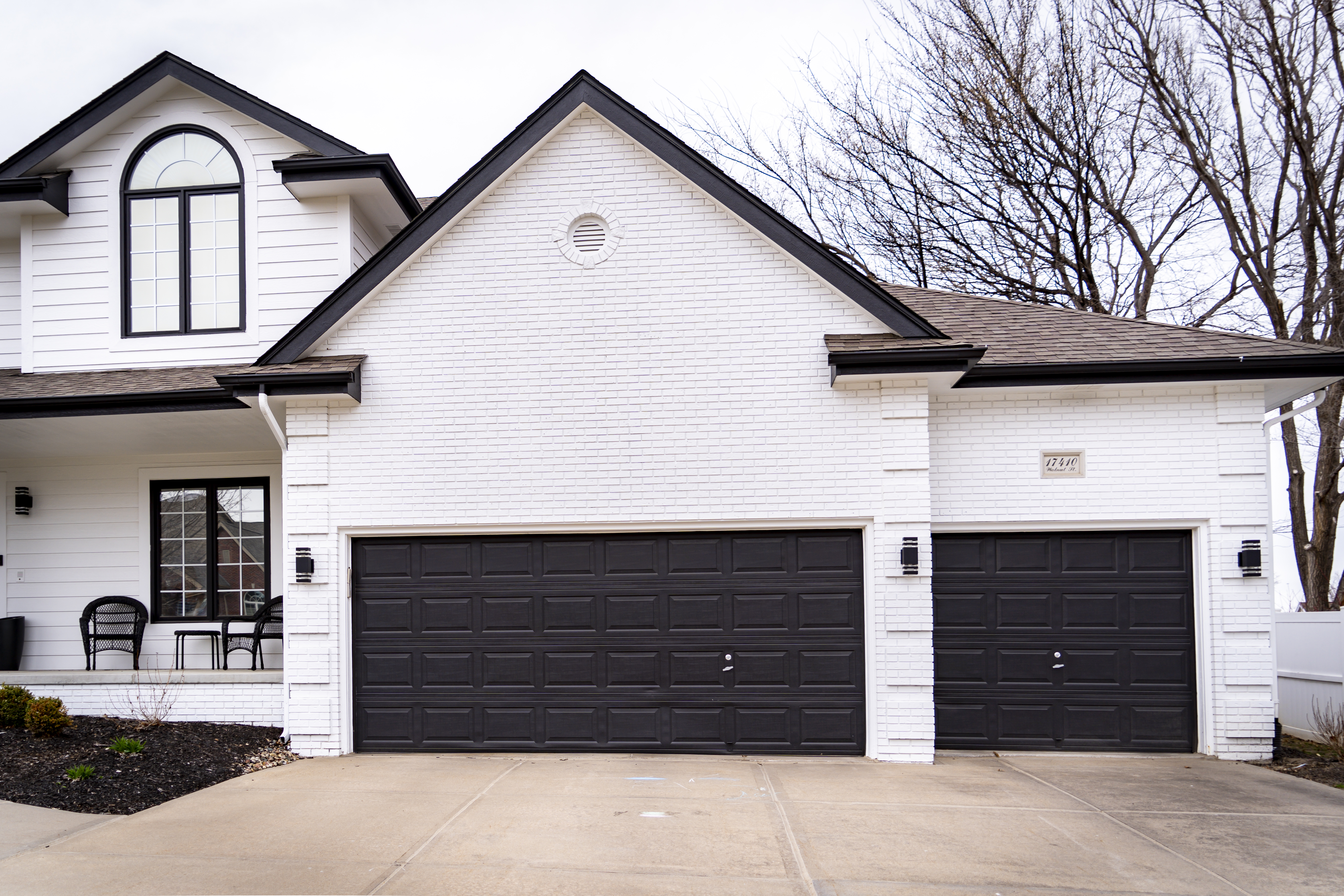 White exterior painted home with black trim and accents.