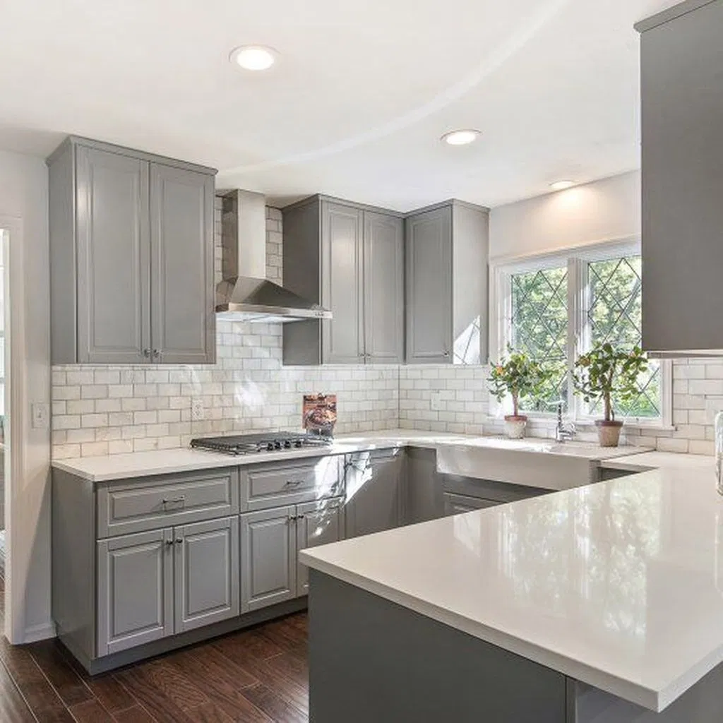 Gray kitchen cabinets with white walls